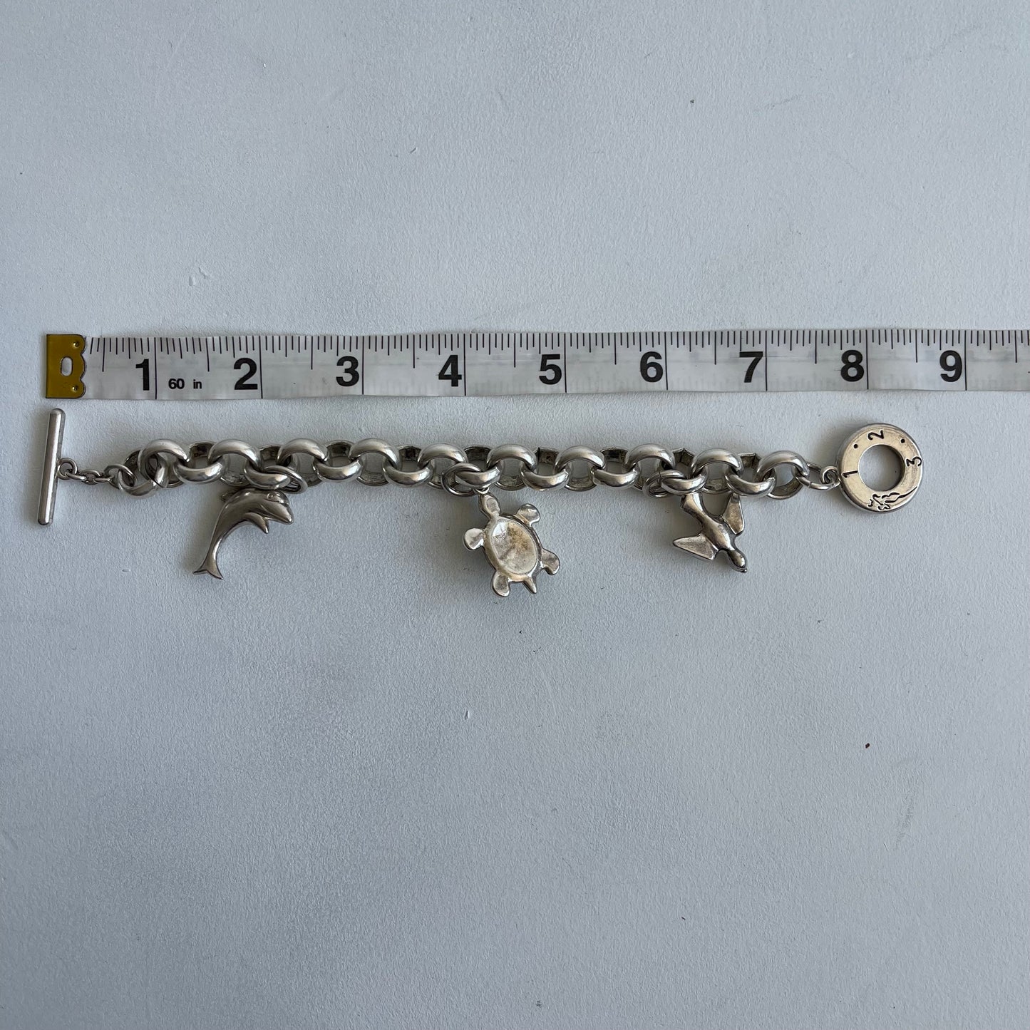 Silver charm bracelet - Size O/S
