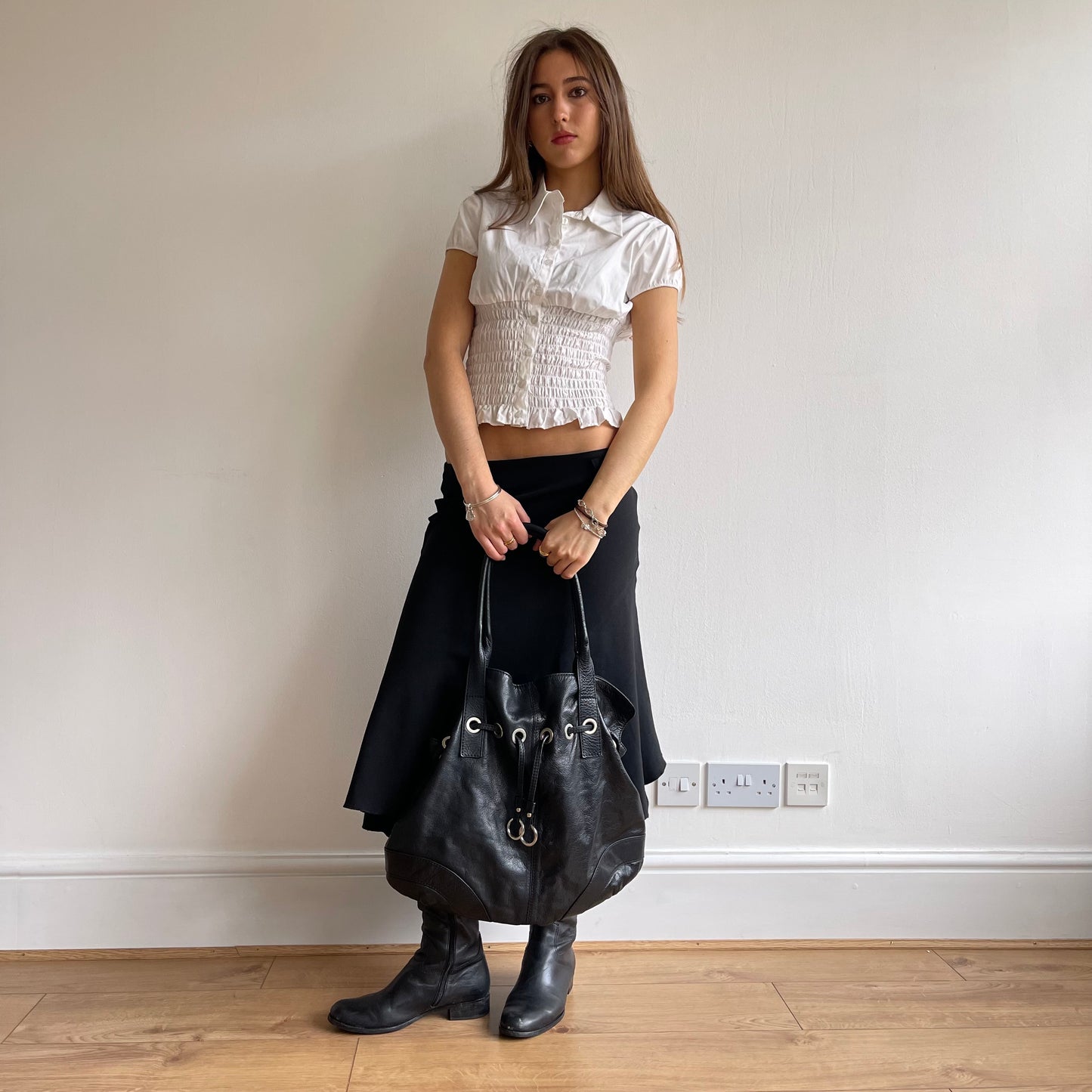 Black grommet slouchy bag