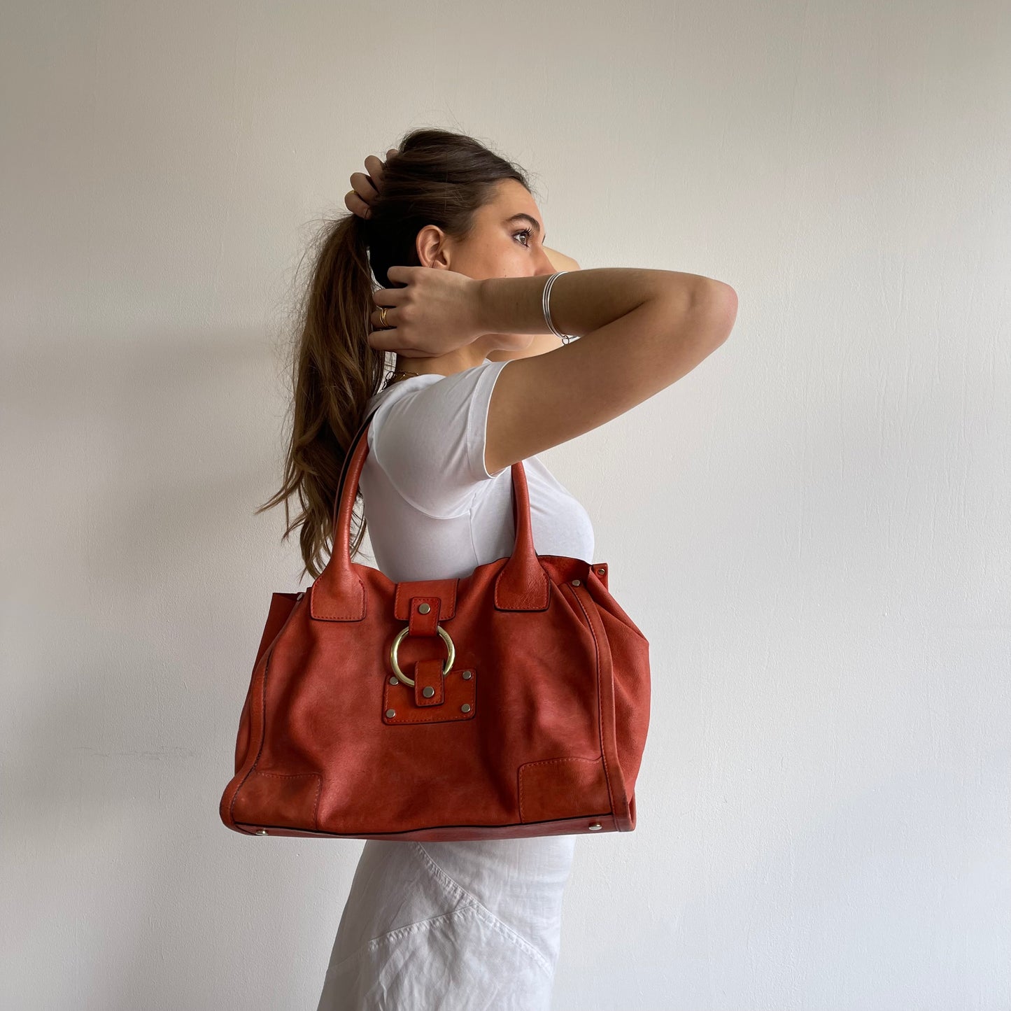 Orange leather slouchy bag