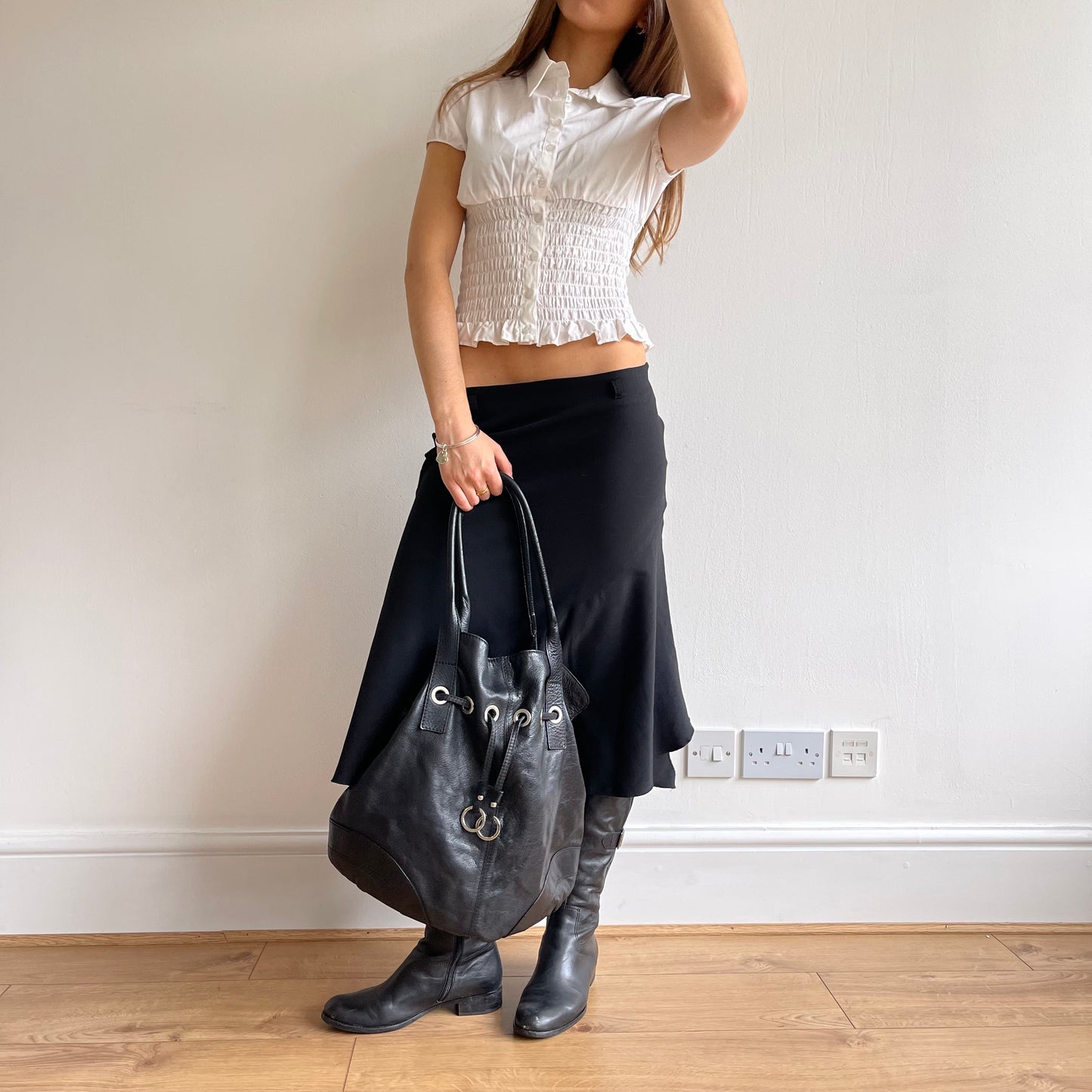 Black grommet slouchy bag