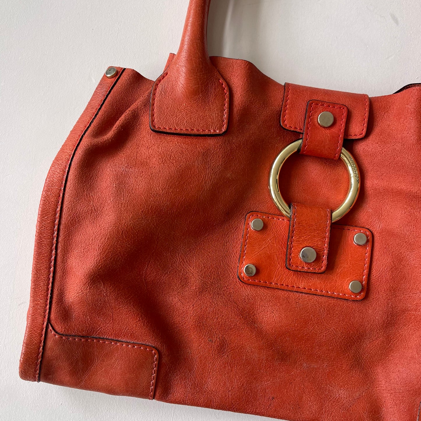 Orange leather slouchy bag