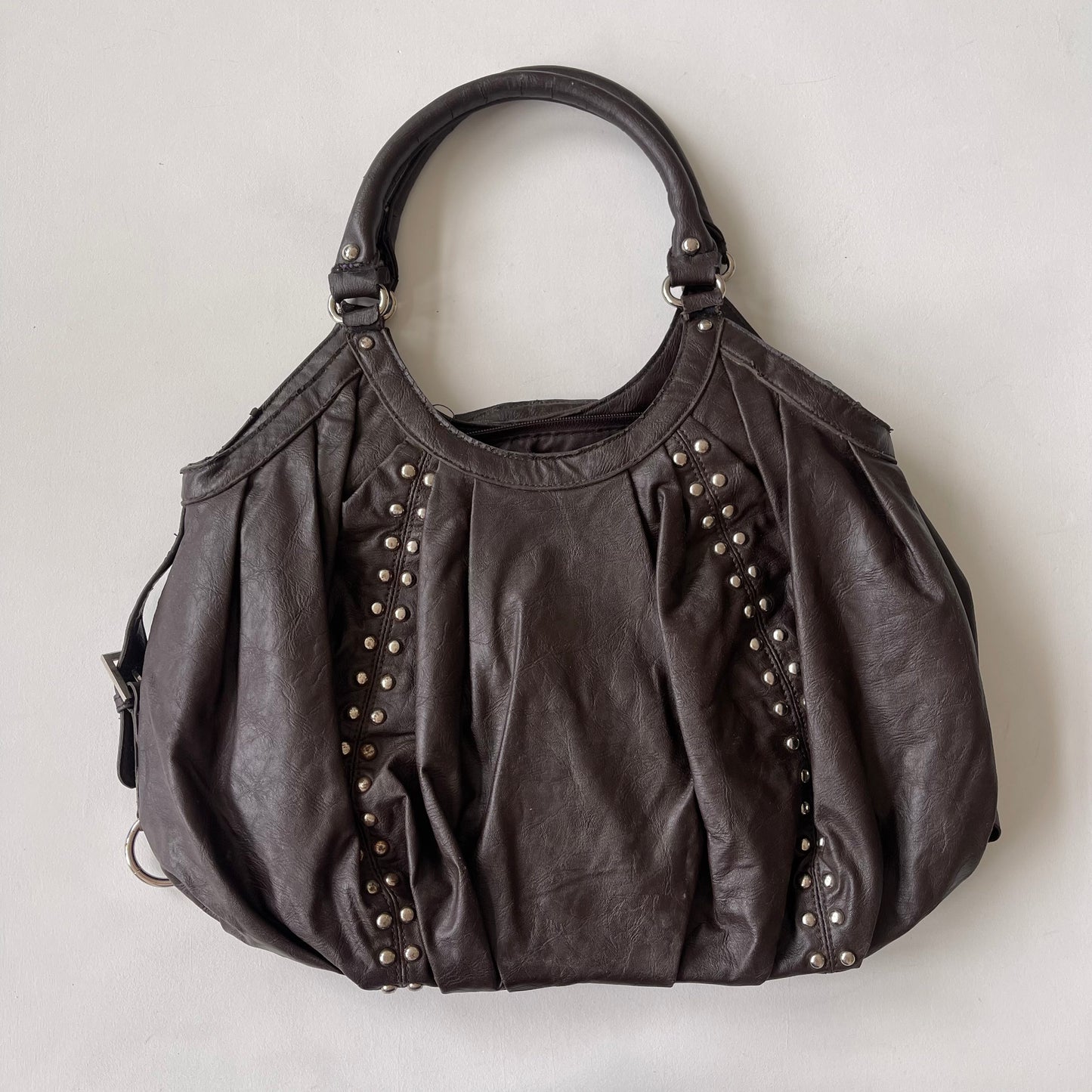 Brown studded slouchy bag