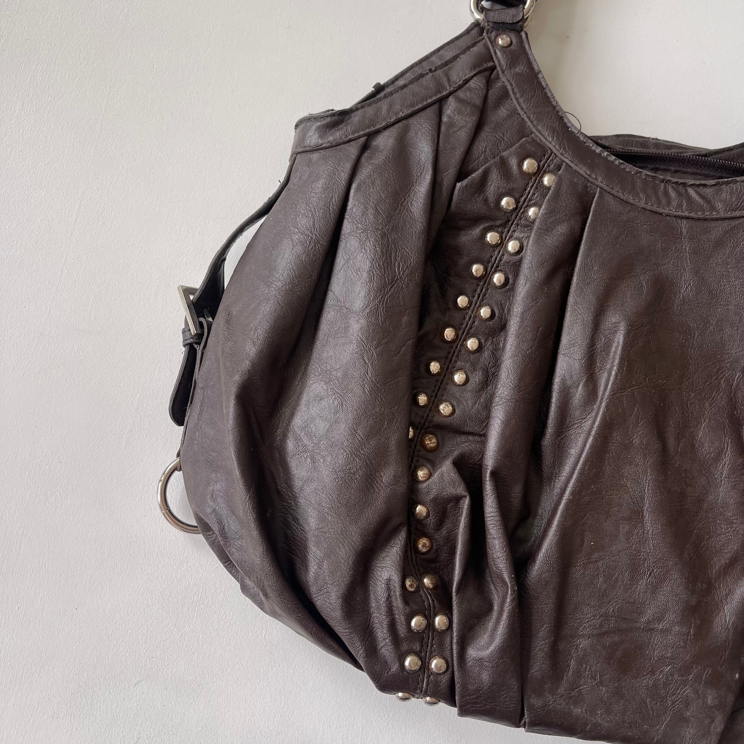 Brown studded slouchy bag