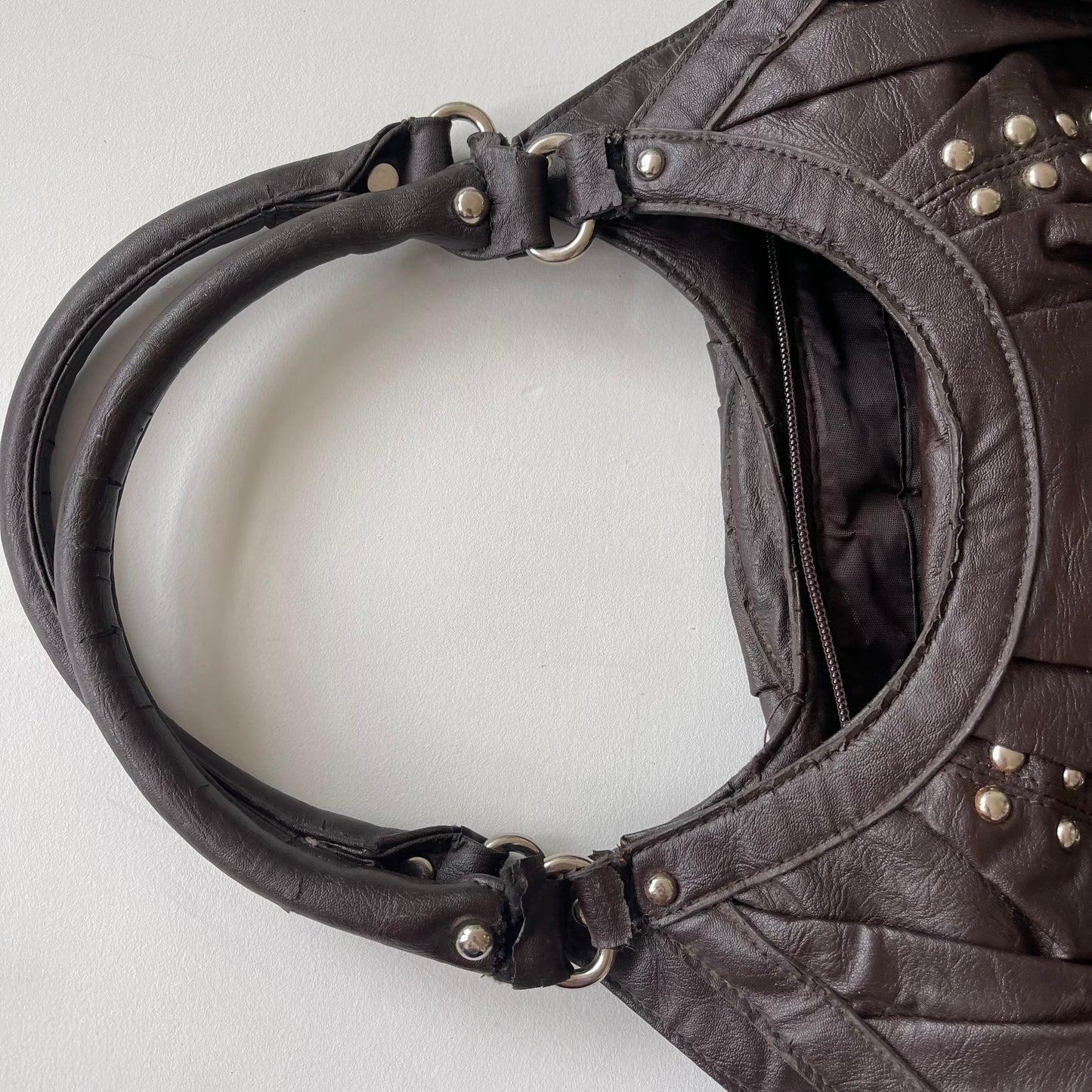 Brown studded slouchy bag