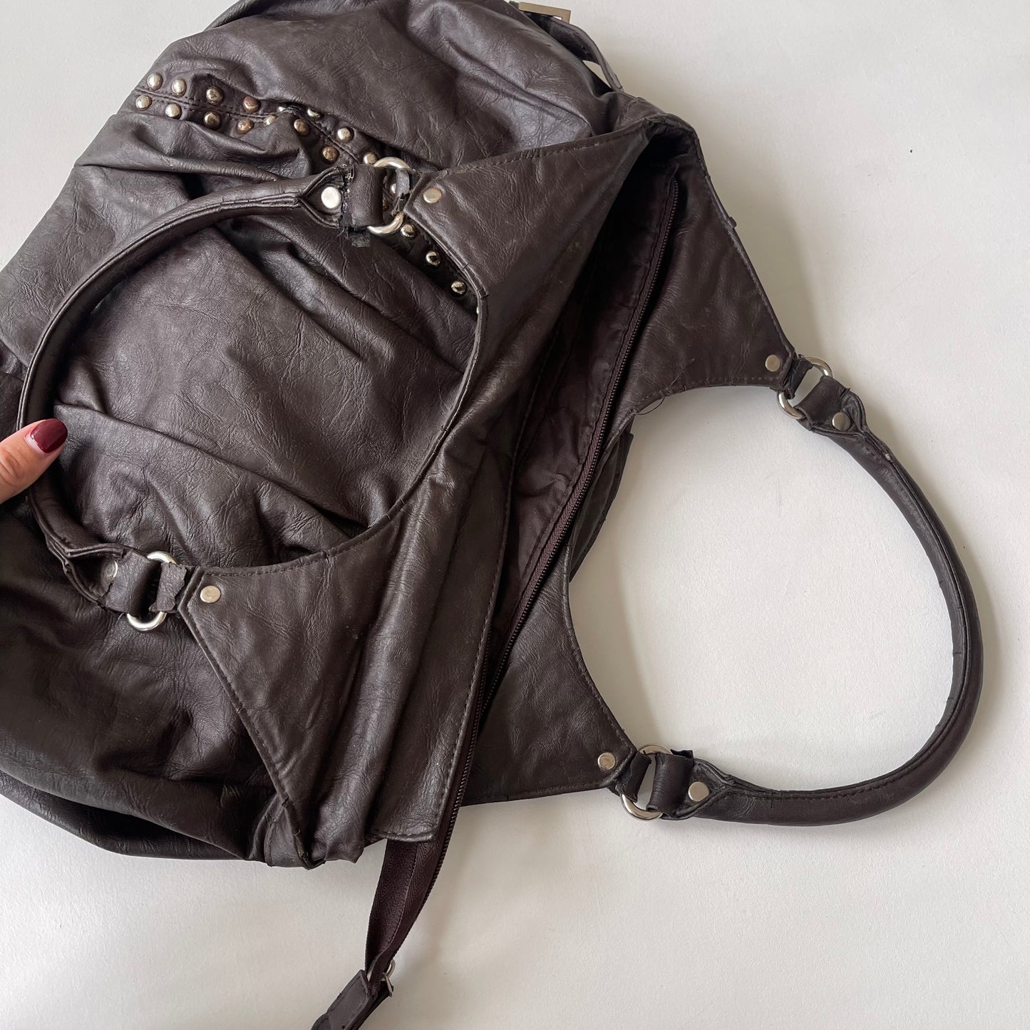 Brown studded slouchy bag