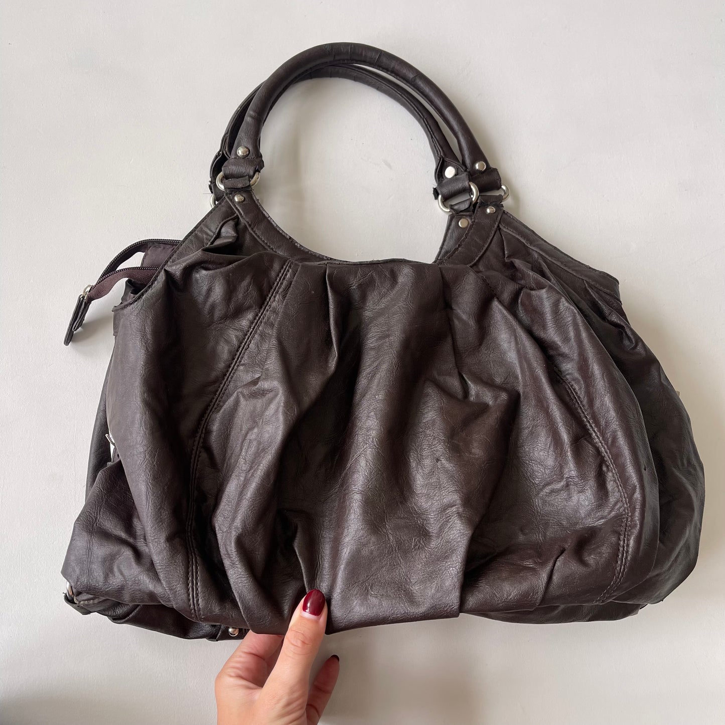 Brown studded slouchy bag