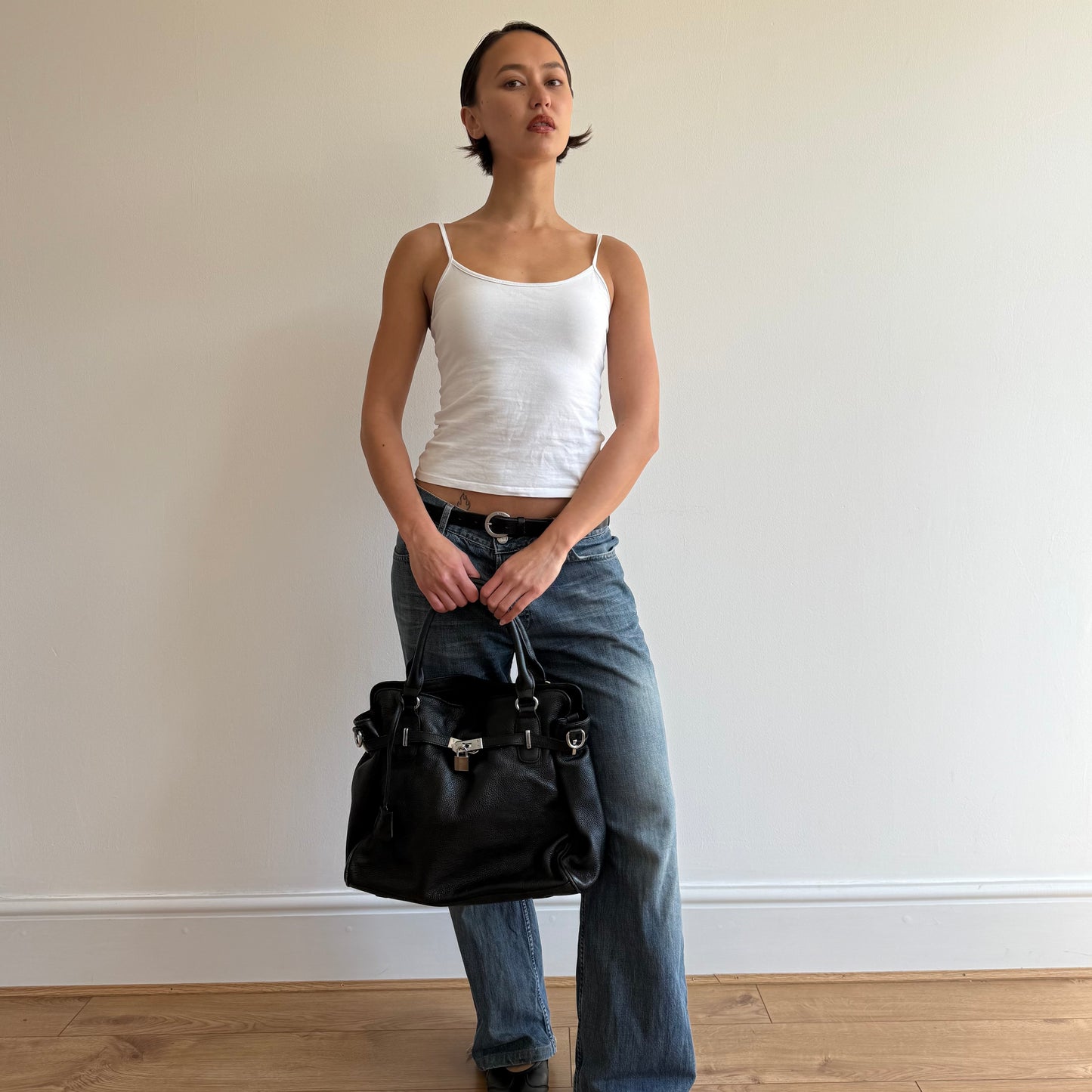 Black leather ‘firkin’ locket bag - One Size