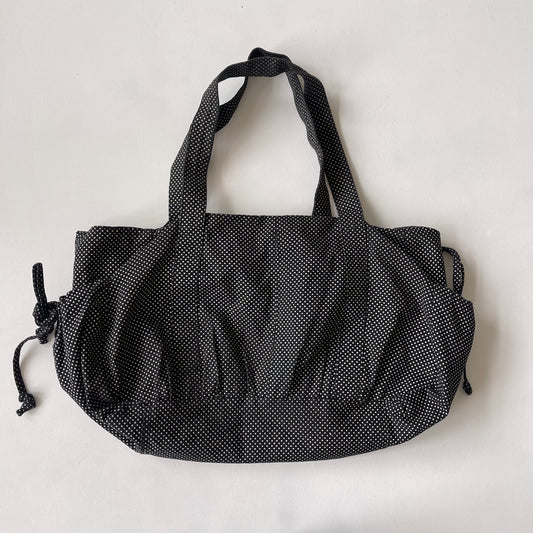 Black drawstring polka dot bag